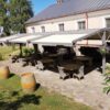 Tradicinė tentinė pergola dvaro kieme