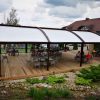 Tradicinė tentinė pergola riestu stogu ant medinio pagrindo